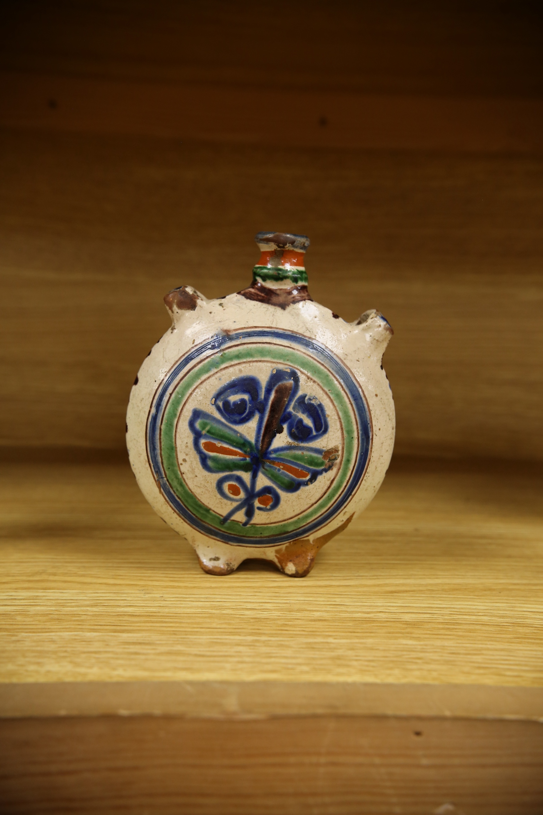 An 18th century? Spanish maiolica pilgrim flask, 17cm. Condition - poor to fair